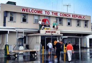 Immigrations to the Conch Republic with sign that reads Welcome to the Conch Republic
